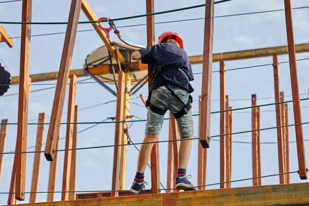 istock Boy walking on the ropes in a rope park 1253834810