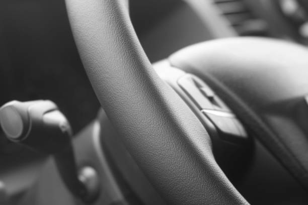 Surface texture of modern car steering wheel against blurred background