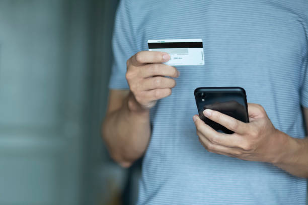 istock using smartphone and credit card online shopping 1253844759