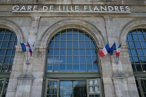 French flag waves in  central train station in Lille, France on Jun. 28, 2020.