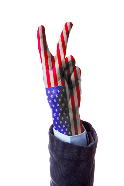 istock Hand making the V sign, USA flag painted 1253845213