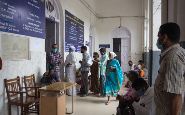 Covid19 patients in line at Hospital in Mysore/India. People waiting in queue to get the primary health check up for the Covid19 Corona virus at a dedicated wing of the Krishnaraja Hospital in Mysore of Karnataka state in India. india hospital stock pictures, royalty-free photos & images
