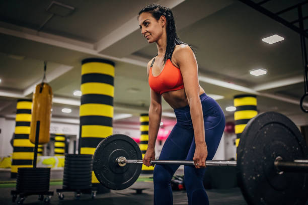 istock One sportswoman training with weights in the gym 1253846051