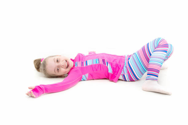 istock Workout of small girl isolated on white background 1253847537