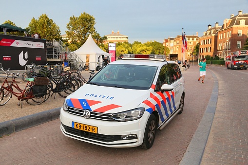 Police car in Amsterdam, Netherlands. Police (Politie) employs more than 63,000 people in the Netherlands.