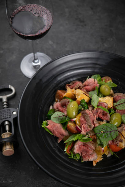 istock Salad with veal, olives, herbs 1253848490
