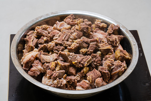 A pile of meat pieces in the pot