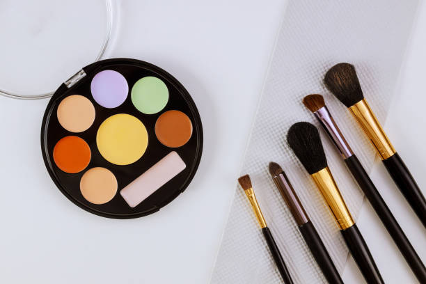 Eyeshadows and blushes on cosmetics as glamour make up products for luxury flat lay design on isolated white background