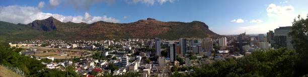 istock Business skyline by mountain side 1253851754