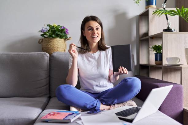 istock Young businesswoman showing on business notebook 1253852865