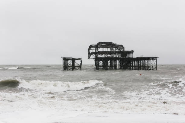 istock Ruins by the sea with beach waves 1253853124