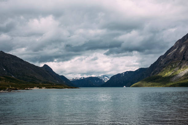 istock Clear water lake by the mountains 1253853179