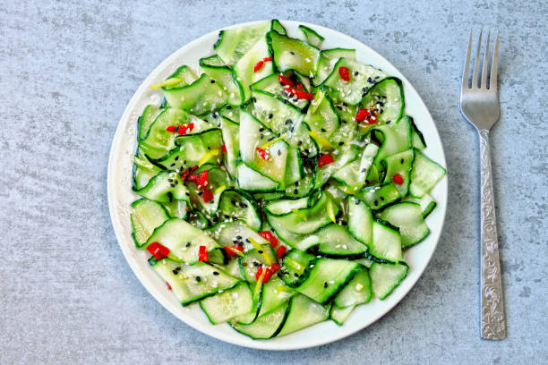 istock Salad with cucumbers and chili pepper. 1253855807