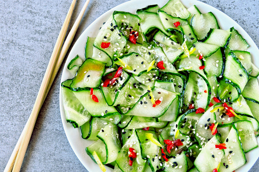 Cucumber salad in Chinese style. Salad with cucumbers and chili pepper. Chinese salad with cucumber.