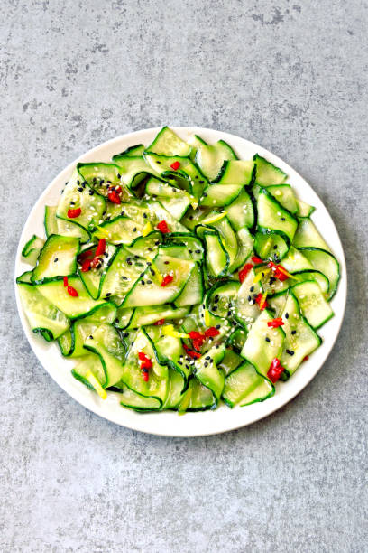 istock Salad with cucumbers and chili pepper. 1253855817