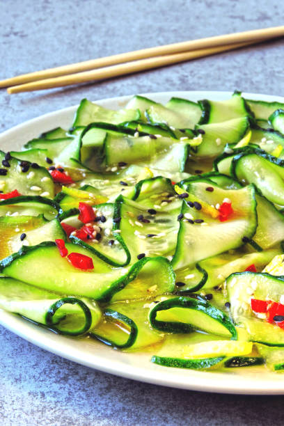 istock Salad with cucumbers and chili pepper. 1253855821