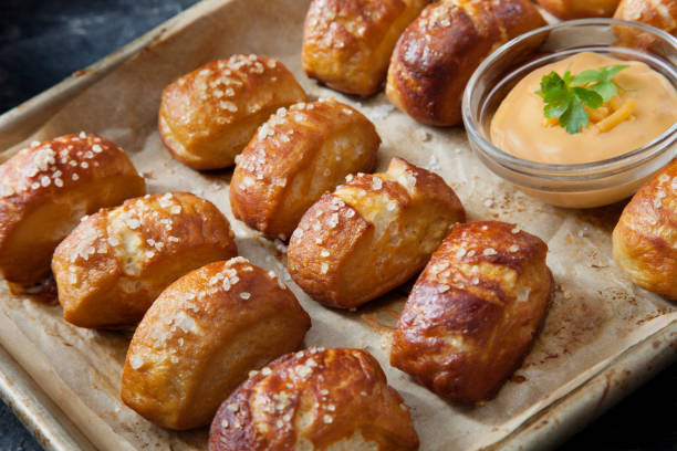 istock Soft Pretzel Bites with A Spicy, Cheesy Salsa Con Queso Dip 1253857999