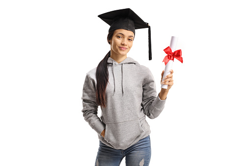 Cute female student with a graduation hat holding a diploma isolated on white background