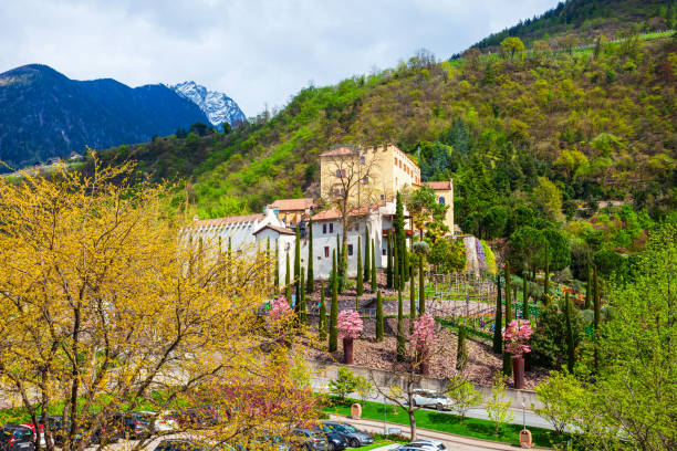 Bolzano, South Tirol, Italy - July 4, 2016. Exterior view of Sigmundskron Castle (Firmiano Castle), rising on a porphyry rock above Frangarto. Considered to be one of the most ancient and largest castle complexes of South Tyrol, it is constructed in the style of the High Middle Ages, only the donjon presents late-Gothic elements. The first historical mention of the castle, under the name Formicaria (later Formigar), dates back to AD 945. Today its ruins house the fourth mountain museum established by the South Tyrolean mountaineer, Reinhold Messner.