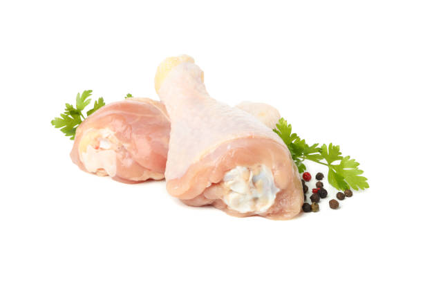 istock Raw chicken meat and spices isolated on white background 1253862355
