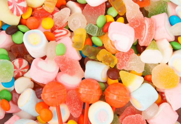 istock Colorful fruit candies and marshmallow background 1253863888