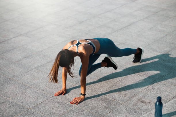 istock Young woman doing the mountain climber exercize 1253864002