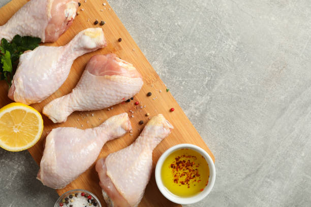 istock Composition with raw chicken meat on gray background, top view 1253864123