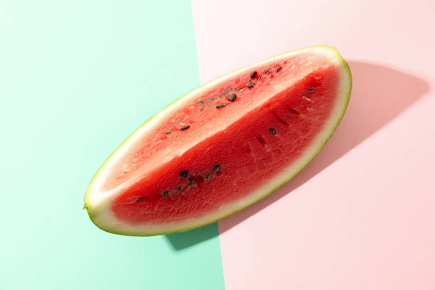 istock Fresh watermelon slice on two tone background. Summer fruit 1253865187
