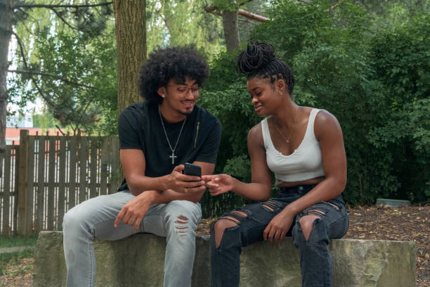 istock Friends hanging out in a park 1253867117