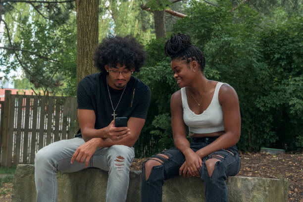 istock Friends hanging out in a park 1253867155