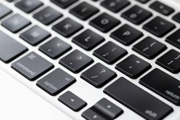 istock Business man using laptop computer at home 1253871323