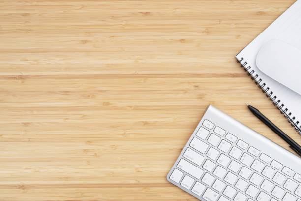istock Work from home,computer on the wood desk 1253871602