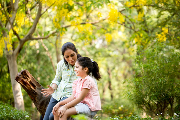 istock Mother and daughter spending leisure time at park 1253873162