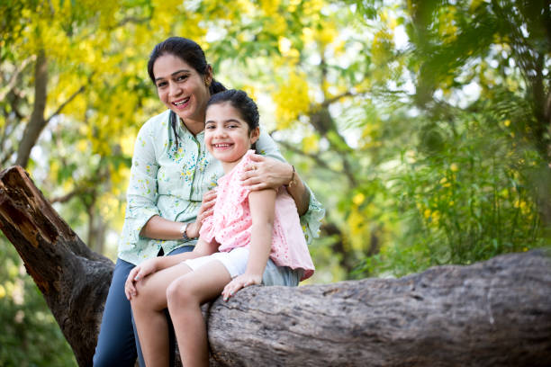 istock Mother and daughter spending leisure time at park 1253873200