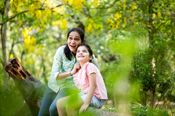Mother and daughter spending leisure time at park