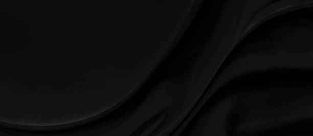 istock Black gray satin dark fabric texture luxurious shiny that is abstract silk cloth panorama background with patterns soft waves blur beautiful. 1253876003