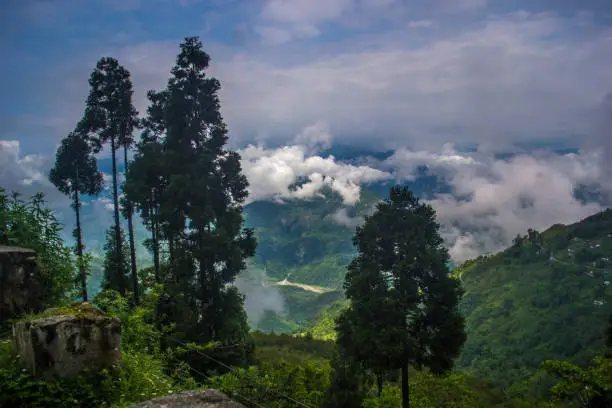 Photo of Mountain valley with lots of cloud s