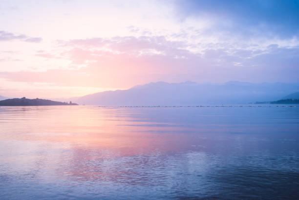 istock Pink and blu sunset in the sea 1253876969