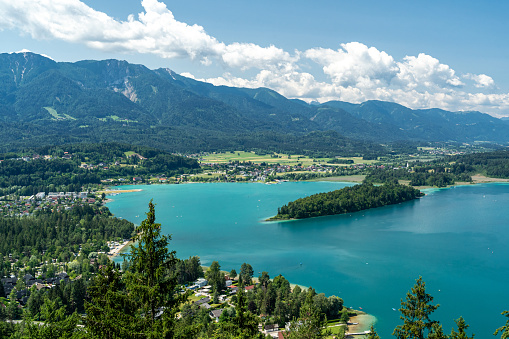 Panoramic view of the intense blue Lake Faak in Carinthia, Austria