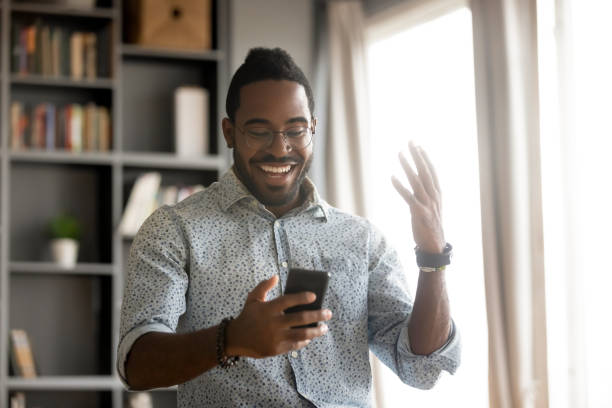istock African man holding smartphone read message feels excited 1253877209