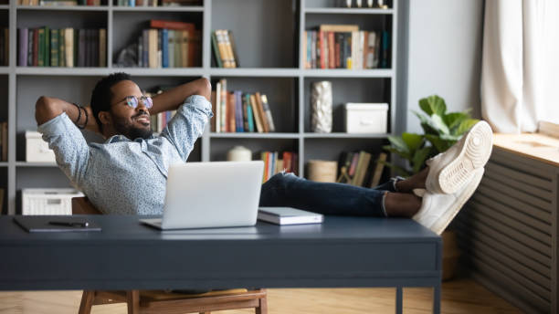 istock African employee enjoy pause during workday dreaming looking at window 1253877738