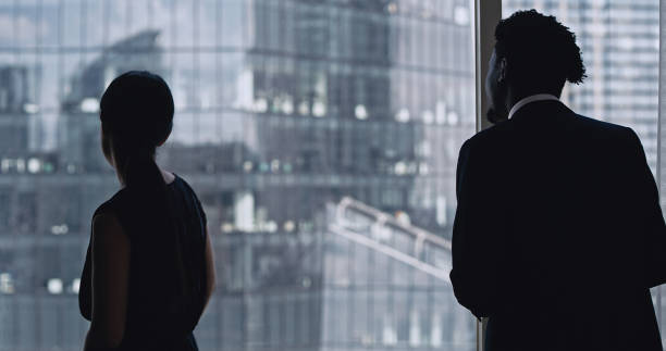 istock Office conversation. Multi ethnic business partners talking 1253878369