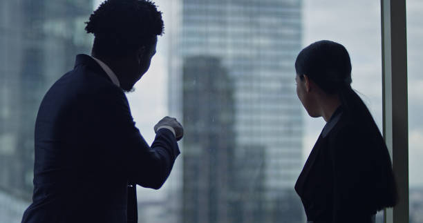 istock Office conversation. Multi ethnic business partners talking 1253878611