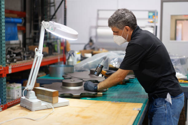 Quality control of gear on a warehouse wearing protective mask