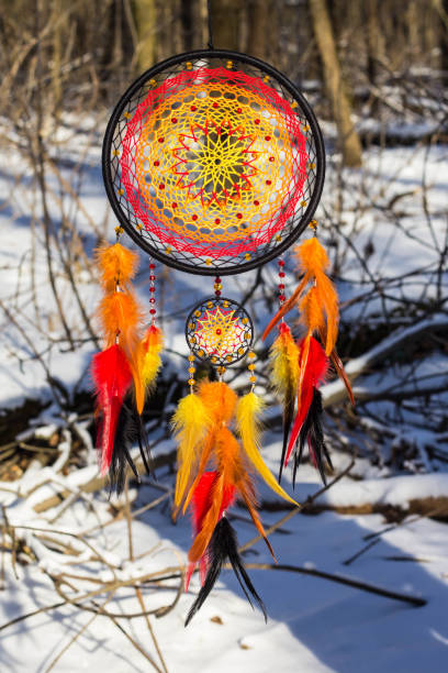 istock Handmade dream catcher with feathers threads and beads rope hanging 1253882660