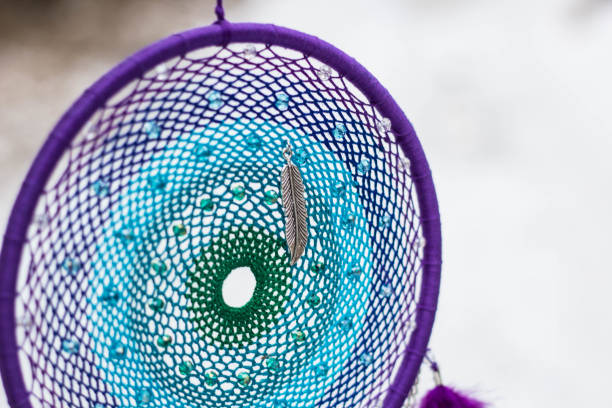 istock Handmade dream catcher with feathers threads and beads rope hanging 1253882661