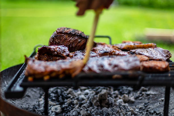 istock barbeque meat preparation in a summer day 1253883179