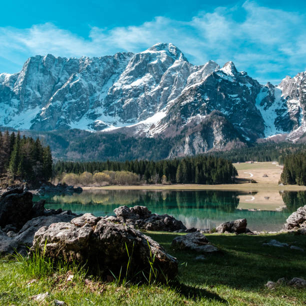istock Spring morning at the alpine lake 1253883746