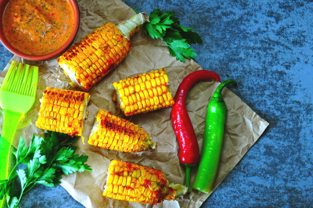 istock Baked corn with chili sauce. 1253886700