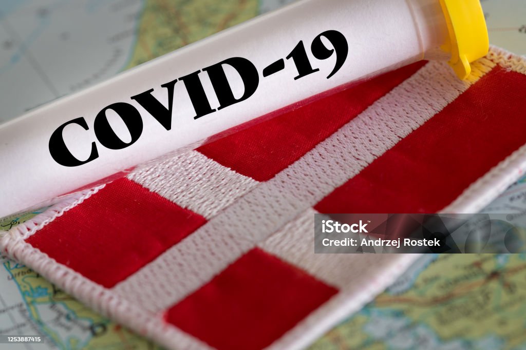 test tube with a positive Coronavirus test against the background of the Danmark flag test tube with a positive Coronavirus test against the background of the Danish flag Coronavirus Stock Photo